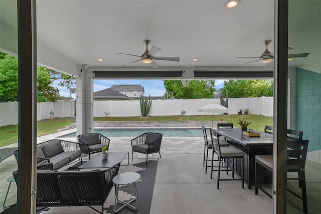 1322 N Bumby Ave, Orlando, FL 32803 - fenced backyard with an outdoor hangout area, ceiling fan, and a patio