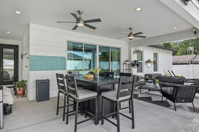 1322 N Bumby Ave, Orlando, FL 32803 - view of patio featuring an outdoor hangout area, ceiling fan, and outdoor dining space