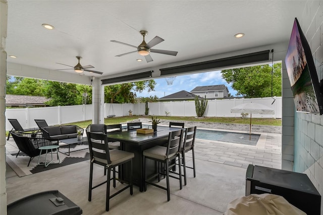 1322 N Bumby Ave, Orlando, FL 32803 - fenced backyard with a patio, an outdoor hangout area, and ceiling fan