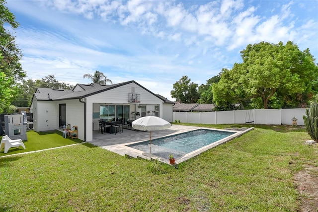 1322 N Bumby Ave, Orlando, FL 32803 - rear view of property with a fenced backyard and a patio area