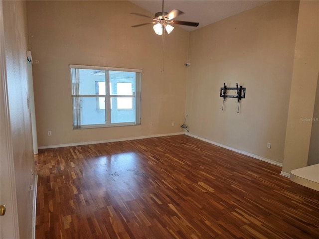 1797 Tillstream Dr, Orlando, FL 32818 - empty room with ceiling fan, wood finished floors, and high vaulted ceiling