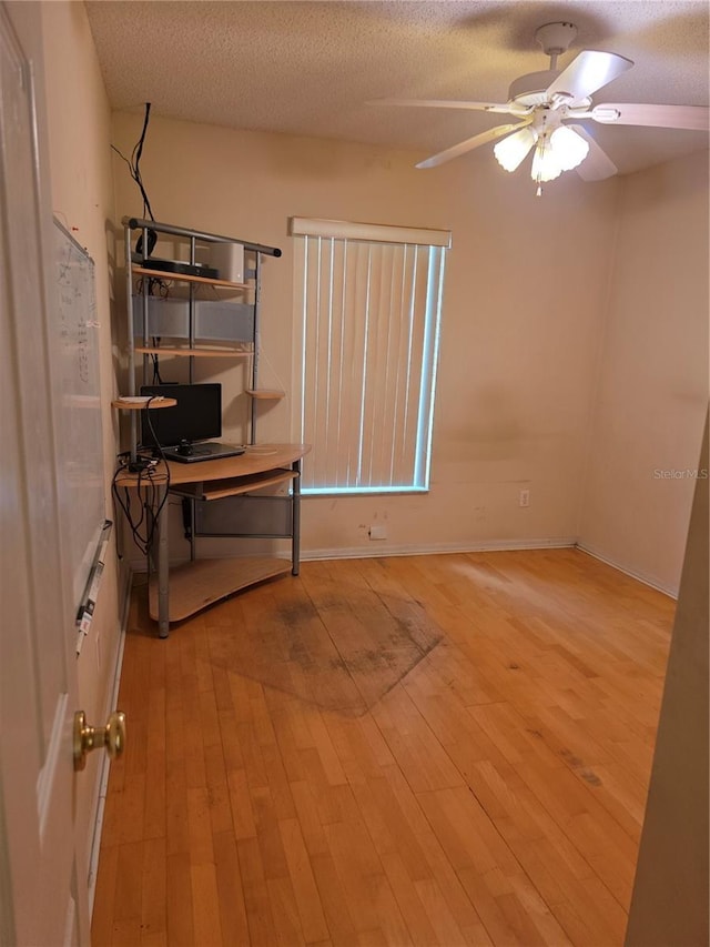 1797 Tillstream Dr, Orlando, FL 32818 - empty room featuring a textured ceiling, a ceiling fan, and light wood finished floors