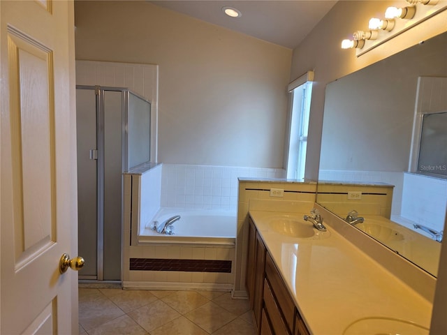 1797 Tillstream Dr, Orlando, FL 32818 - full bathroom featuring double vanity, a stall shower, a garden tub, tile patterned floors, and recessed lighting