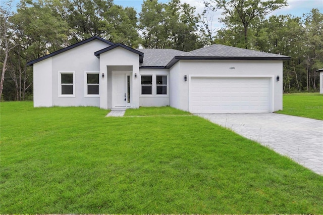 10599 N Umber Ter, Citrus Springs, FL 34434 - ranch-style home featuring stucco siding, an attached garage, decorative driveway, and a front lawn