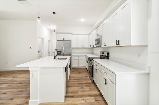 10599 N Umber Ter, Citrus Springs, FL 34434 - kitchen featuring stainless steel appliances, light wood-style floors, light countertops, and recessed lighting
