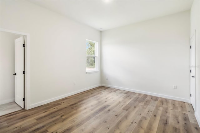 10599 N Umber Ter, Citrus Springs, FL 34434 - empty room featuring light wood-style floors and baseboards