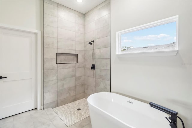 10599 N Umber Ter, Citrus Springs, FL 34434 - bathroom with a freestanding tub and a tile shower