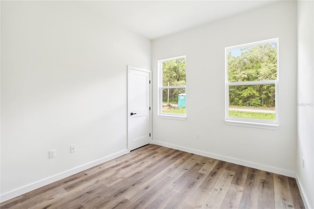 10599 N Umber Ter, Citrus Springs, FL 34434 - spare room featuring light wood finished floors and baseboards