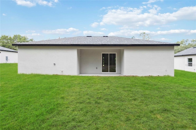 10599 N Umber Ter, Citrus Springs, FL 34434 - back of property with a lawn, stucco siding, and a patio