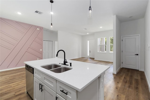 10611 N Umber Ter, Citrus Springs, FL 34434 - kitchen featuring dishwasher, decorative light fixtures, light wood-type flooring, light countertops, and recessed lighting