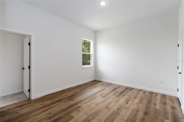 10611 N Umber Ter, Citrus Springs, FL 34434 - unfurnished bedroom featuring light wood finished floors and recessed lighting