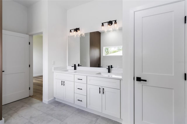 10611 N Umber Ter, Citrus Springs, FL 34434 - full bathroom featuring double vanity and baseboards
