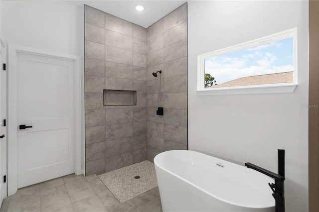 10611 N Umber Ter, Citrus Springs, FL 34434 - bathroom featuring a freestanding bath, a tile shower, and recessed lighting