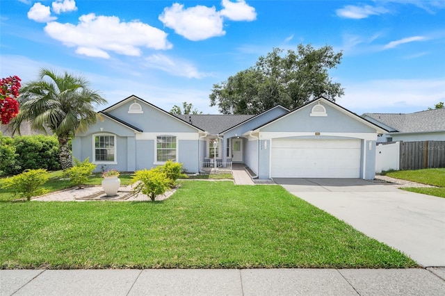 1322 Ravida Woods Dr, Apopka, FL 32703 - ranch-style home featuring stucco siding, an attached garage, and concrete driveway