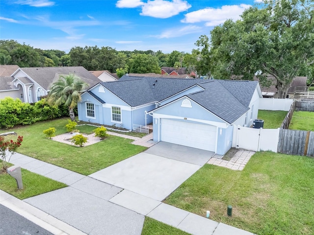 1322 Ravida Woods Dr, Apopka, FL 32703 - ranch-style home with an attached garage, a gate, stucco siding, and a shingled roof