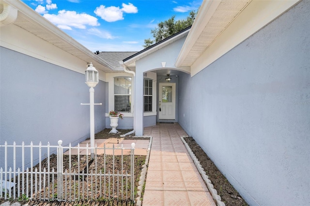 1322 Ravida Woods Dr, Apopka, FL 32703 - doorway to property with stucco siding