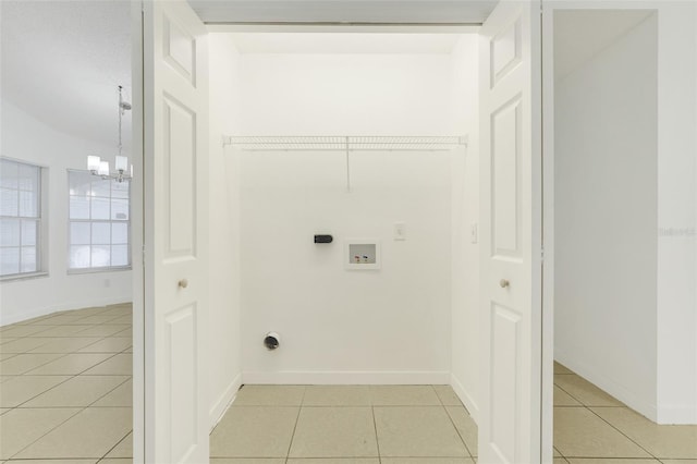 1322 Ravida Woods Dr, Apopka, FL 32703 - laundry area featuring washer hookup, light tile patterned floors, a chandelier, and electric dryer hookup