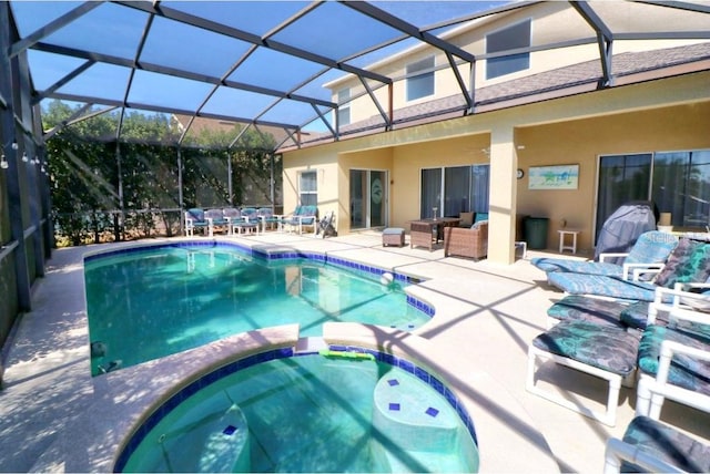 331 Bridgewater Dr, Davenport, FL 33897 - view of swimming pool with a patio, outdoor lounge area, a pool with connected hot tub, outdoor dining area, and glass enclosure