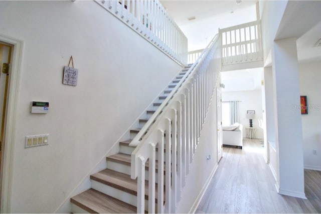 331 Bridgewater Dr, Davenport, FL 33897 - stairs with a towering ceiling, plenty of natural light, and wood finished floors