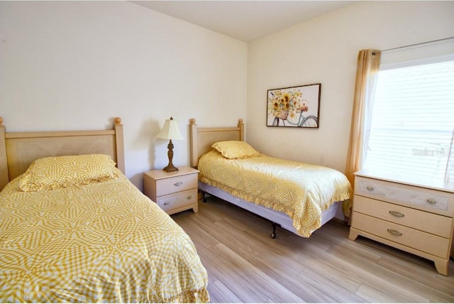 331 Bridgewater Dr, Davenport, FL 33897 - bedroom featuring light wood-type flooring and multiple windows