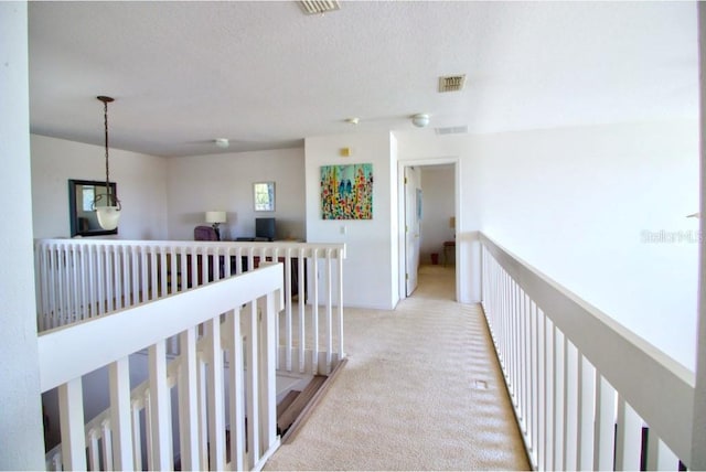 331 Bridgewater Dr, Davenport, FL 33897 - corridor with light colored carpet and an upstairs landing