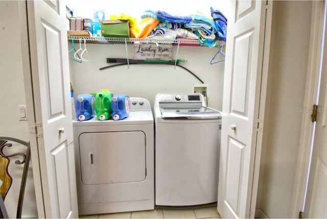 331 Bridgewater Dr, Davenport, FL 33897 - washroom with separate washer and dryer and light tile patterned floors