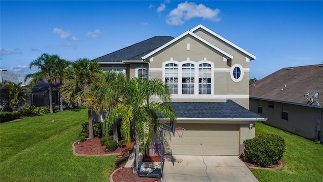 2530 The Oaks Blvd, Kissimmee, FL 34746 - view of front of home featuring stucco siding, a garage, concrete driveway, a front lawn, and a shingled roof