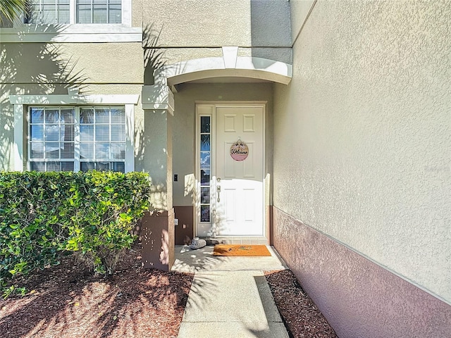 2530 The Oaks Blvd, Kissimmee, FL 34746 - doorway to property featuring stucco siding