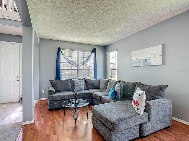 2530 The Oaks Blvd, Kissimmee, FL 34746 - living area with wood finished floors and a textured ceiling