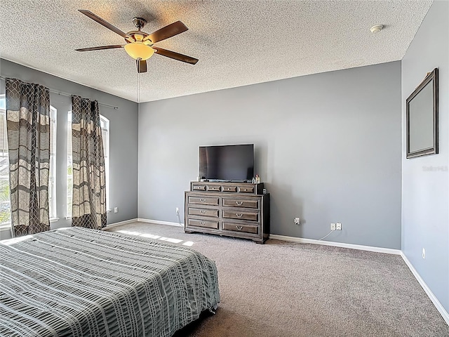 2530 The Oaks Blvd, Kissimmee, FL 34746 - bedroom featuring carpet floors, ceiling fan, and a textured ceiling