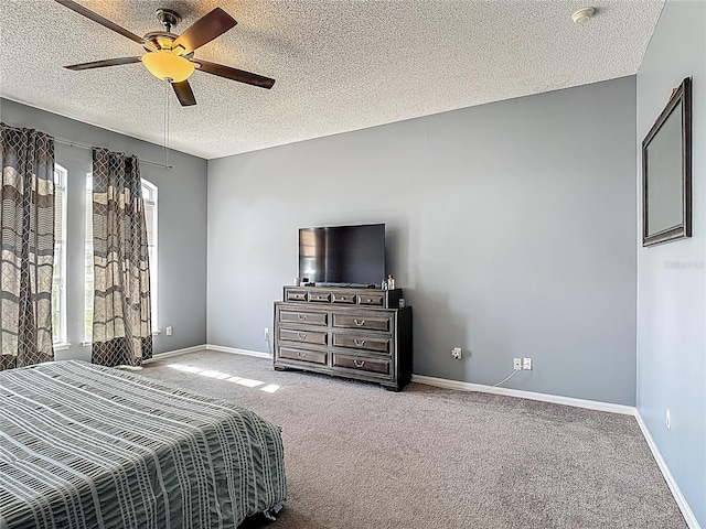 2530 The Oaks Blvd, Kissimmee, FL 34746 - bedroom with carpet, a textured ceiling, and a ceiling fan