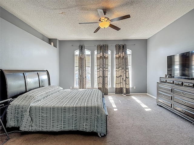 2530 The Oaks Blvd, Kissimmee, FL 34746 - carpeted bedroom with a textured ceiling and ceiling fan