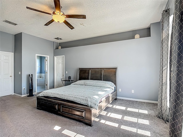 2530 The Oaks Blvd, Kissimmee, FL 34746 - bedroom featuring light colored carpet, a textured ceiling, ceiling fan, and ensuite bath