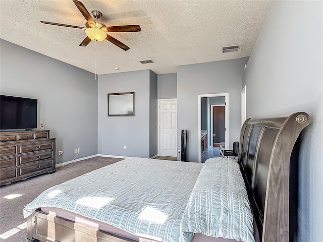 2530 The Oaks Blvd, Kissimmee, FL 34746 - carpeted bedroom with a textured ceiling and a ceiling fan