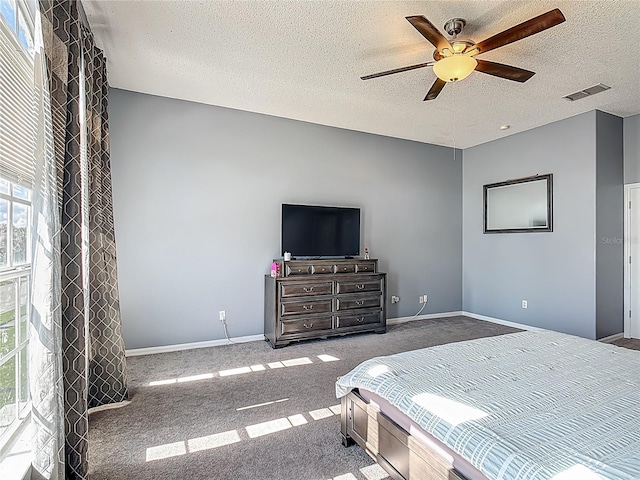 2530 The Oaks Blvd, Kissimmee, FL 34746 - bedroom featuring carpet, a textured ceiling, and ceiling fan