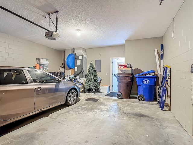 2530 The Oaks Blvd, Kissimmee, FL 34746 - garage with electric panel, a garage door opener, concrete block wall, and heating unit