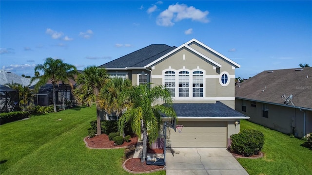 2530 The Oaks Blvd, Kissimmee, FL 34746 - view of front of home with stucco siding, a garage, concrete driveway, and a front yard