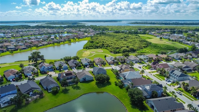 2530 The Oaks Blvd, Kissimmee, FL 34746 - aerial perspective of suburban area featuring a local golf course and a large body of water