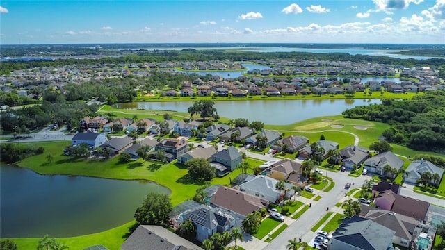 2530 The Oaks Blvd, Kissimmee, FL 34746 - aerial view of residential area featuring a nearby body of water and a local golf course