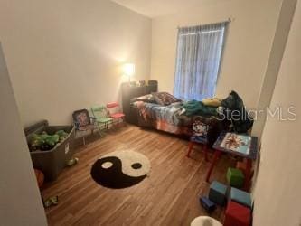 2770 Club Cortile Cir Unit A, Kissimmee, FL 34746 - living area with wood finished floors