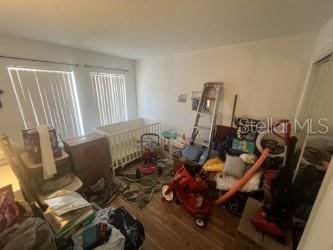 2770 Club Cortile Cir Unit A, Kissimmee, FL 34746 - bedroom featuring wood finished floors