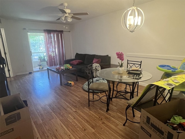 2770 Club Cortile Cir Unit A, Kissimmee, FL 34746 - dining room featuring wood finished floors, ceiling fan, and a chandelier