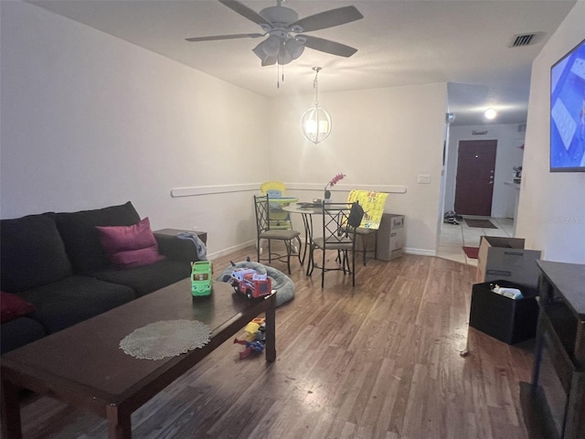 2770 Club Cortile Cir Unit A, Kissimmee, FL 34746 - living room with wood finished floors and a ceiling fan