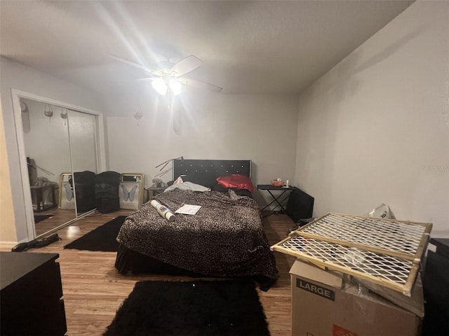 2770 Club Cortile Cir Unit A, Kissimmee, FL 34746 - bedroom with wood finished floors, a ceiling fan, and a closet