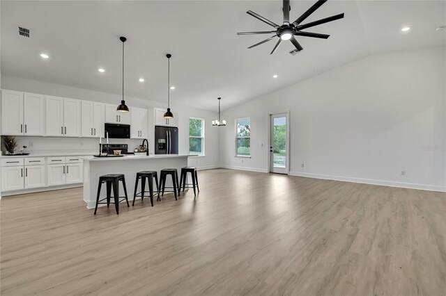 9739 Loretto St, Spring Hill, FL 34608 - kitchen with black appliances, open floor plan, recessed lighting, a kitchen breakfast bar, and ceiling fan