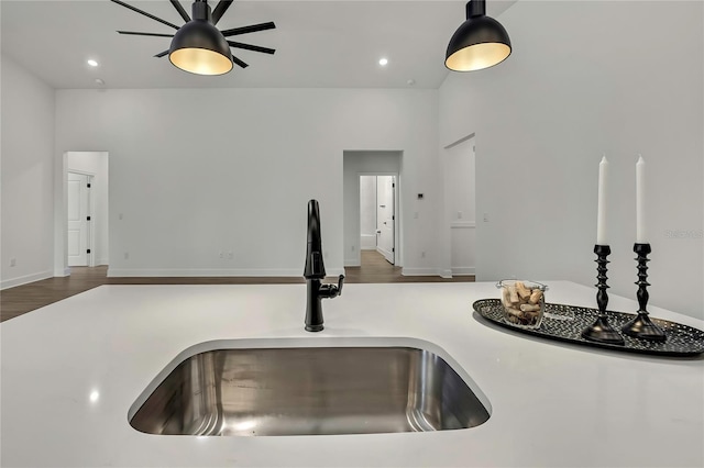9739 Loretto St, Spring Hill, FL 34608 - detailed view of a ceiling fan, decorative light fixtures, wood finished floors, light countertops, and recessed lighting