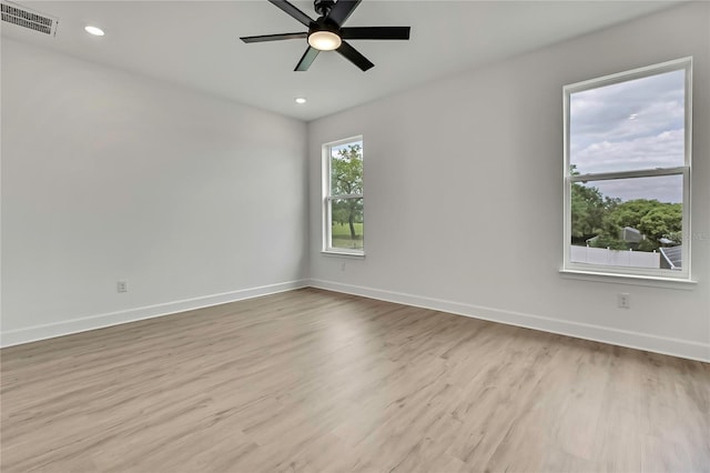 9739 Loretto St, Spring Hill, FL 34608 - unfurnished room with wood finished floors, a ceiling fan, and recessed lighting