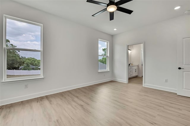9739 Loretto St, Spring Hill, FL 34608 - unfurnished bedroom with light wood-style flooring, ensuite bath, recessed lighting, and ceiling fan
