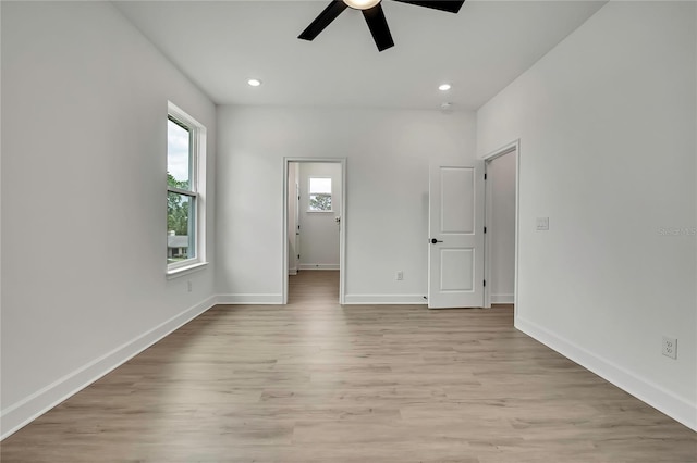 9739 Loretto St, Spring Hill, FL 34608 - unfurnished bedroom with light wood-type flooring, recessed lighting, and ceiling fan