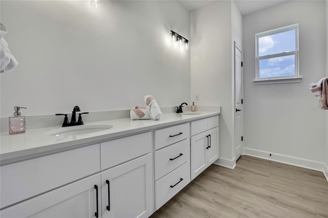 9739 Loretto St, Spring Hill, FL 34608 - bathroom featuring wood finished floors and double vanity